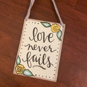 Love never fails plaque